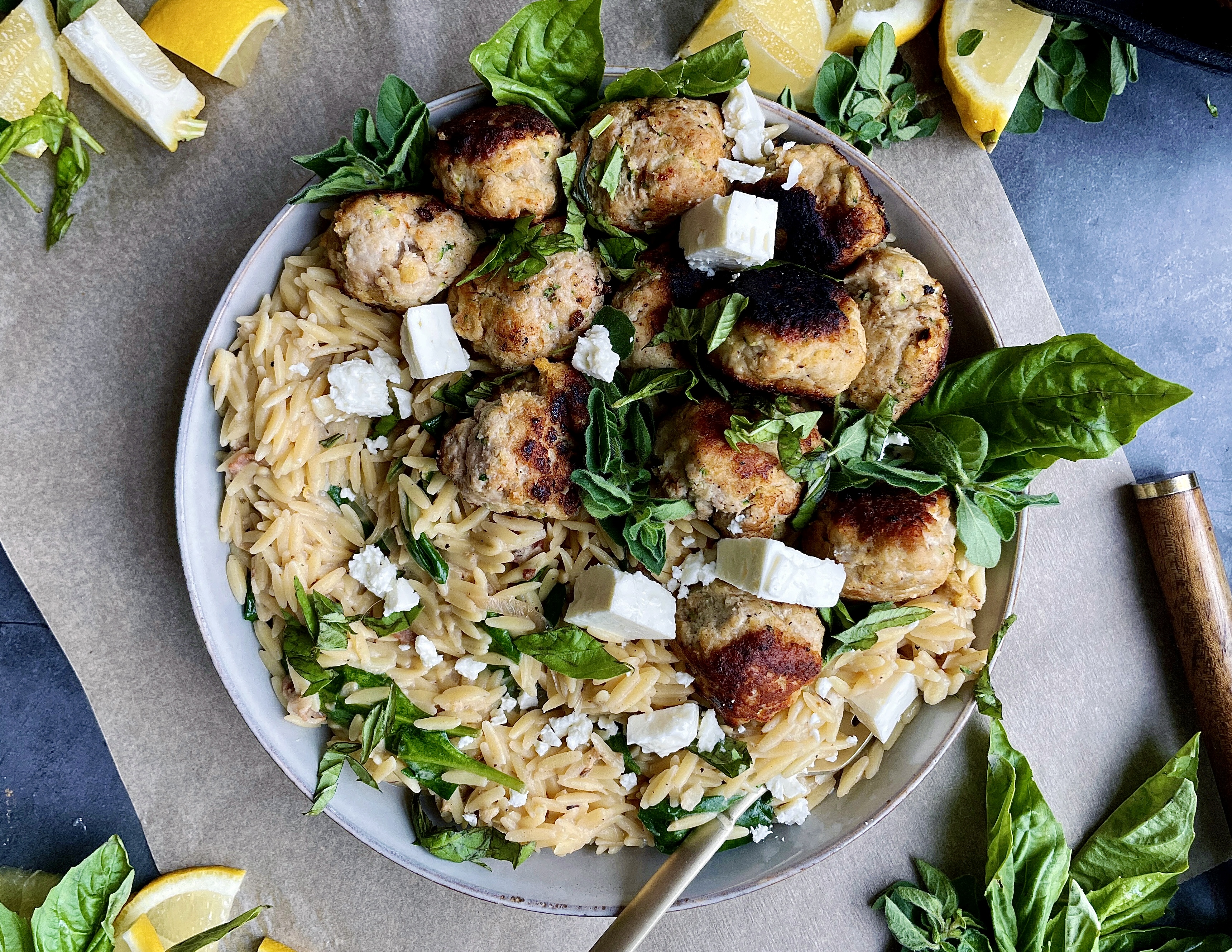 Crispy seared meatballs tucked into a creamy orzo skillet with some salty pancetta, all the lemon, and a whole lotta parm: this Cheesy Lemon Orzo Meatball Skillet is truly the dinner we all need right now.