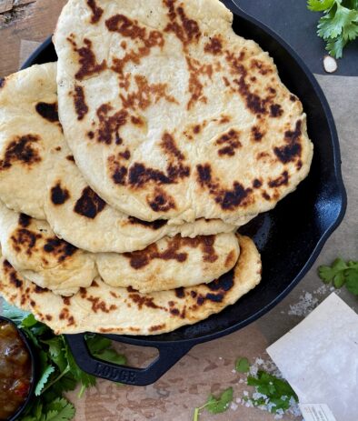 A fluffy, warm doughy exterior with crispy pan fried edges: this Easy Homemade Naan is truly a staple in my house.