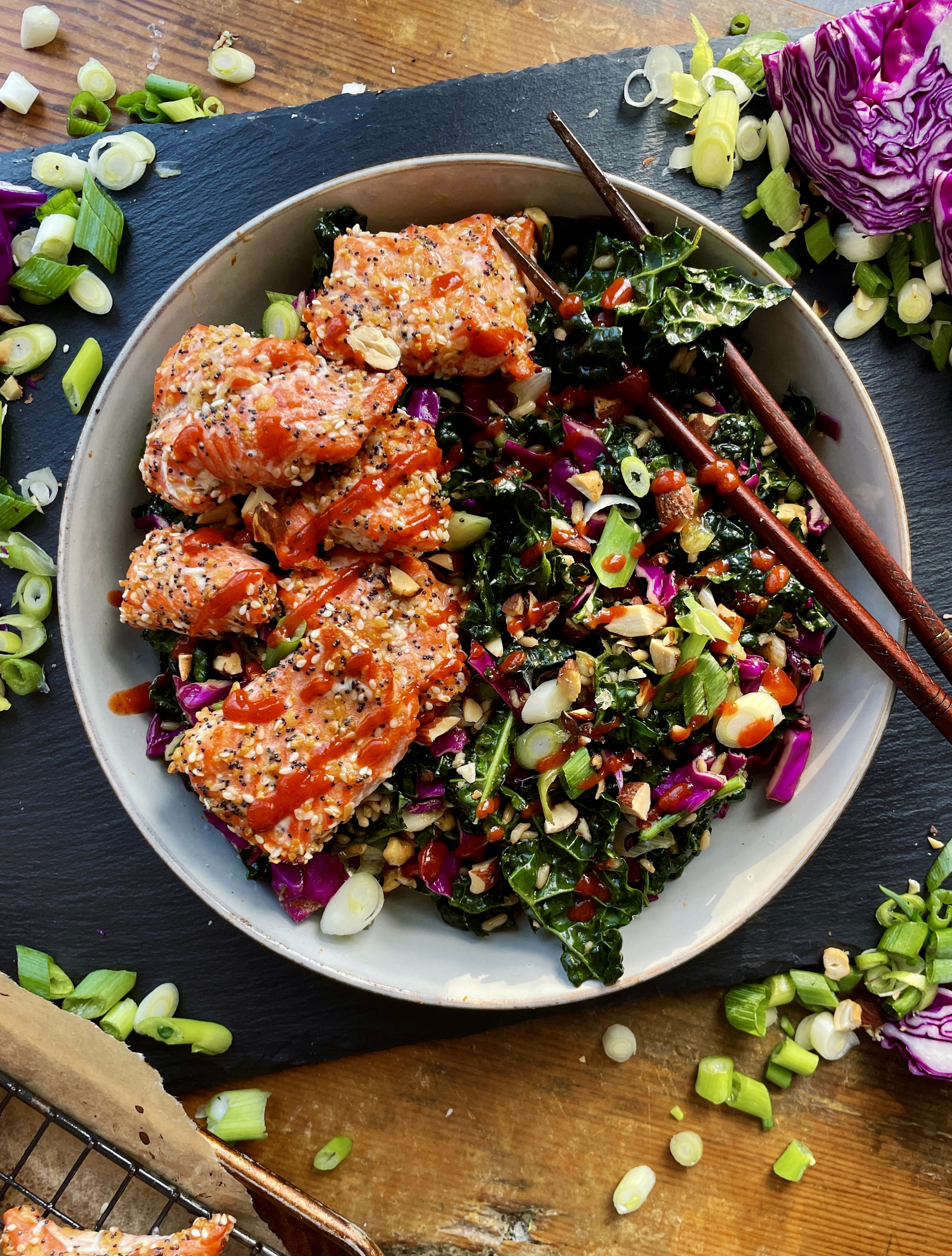 Crispy sesame and everything bagel seasoning baked salmon bites over a super simple Asian kale salad: this Sesame Salmon Bites with Sweet Chili Shredded Kale recipe is the best way to kick off the new year!