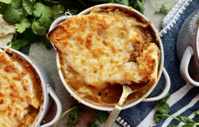 The most creamy, spiced curried lentil soup simmered with alllll the flavors on the stove and divided into “French onion soup” style ramekins with melty fontina and plush naan: this Cheesy Curried Lentil Soup Ramekins with Naan Croutons recipe is the best way to warm up this winter!