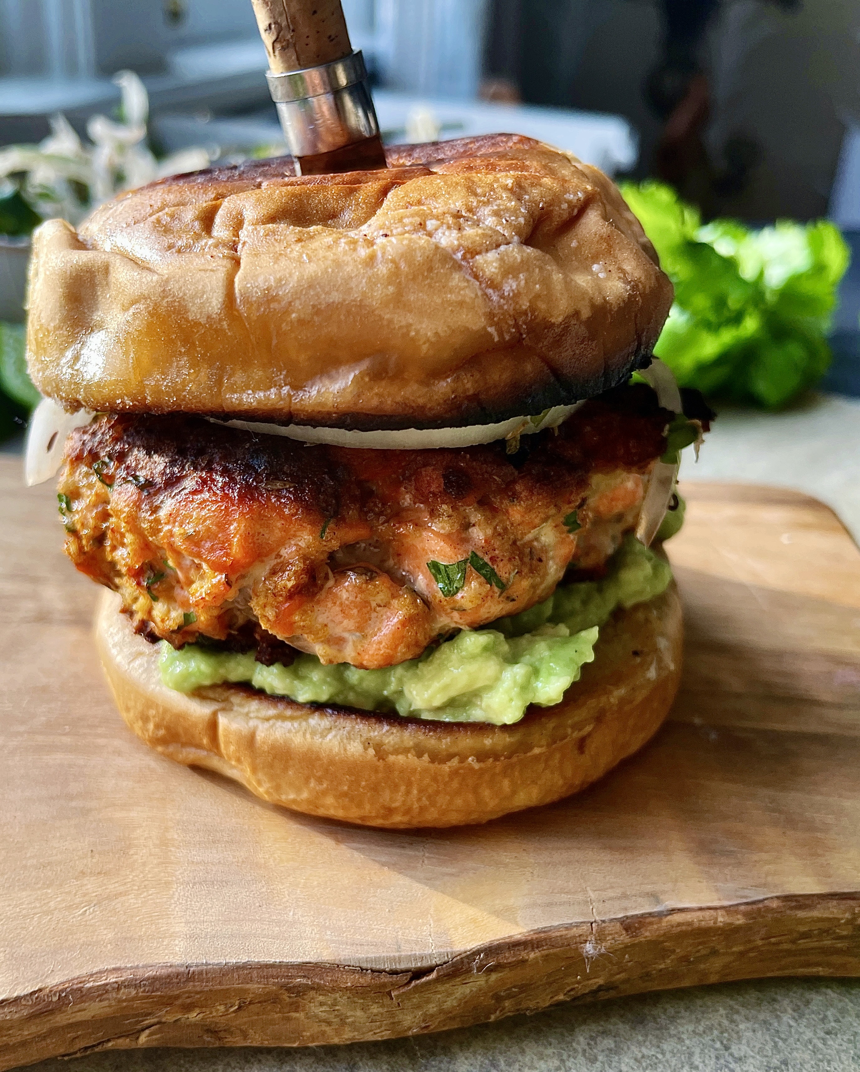 Crispy, juicy, and slightly tangy salmon patties layered over an easy avocado mash and cilantro marinated onions: these Zesty Avocado Cilantro Salmon Burgers are truly a game-changing dinner. 