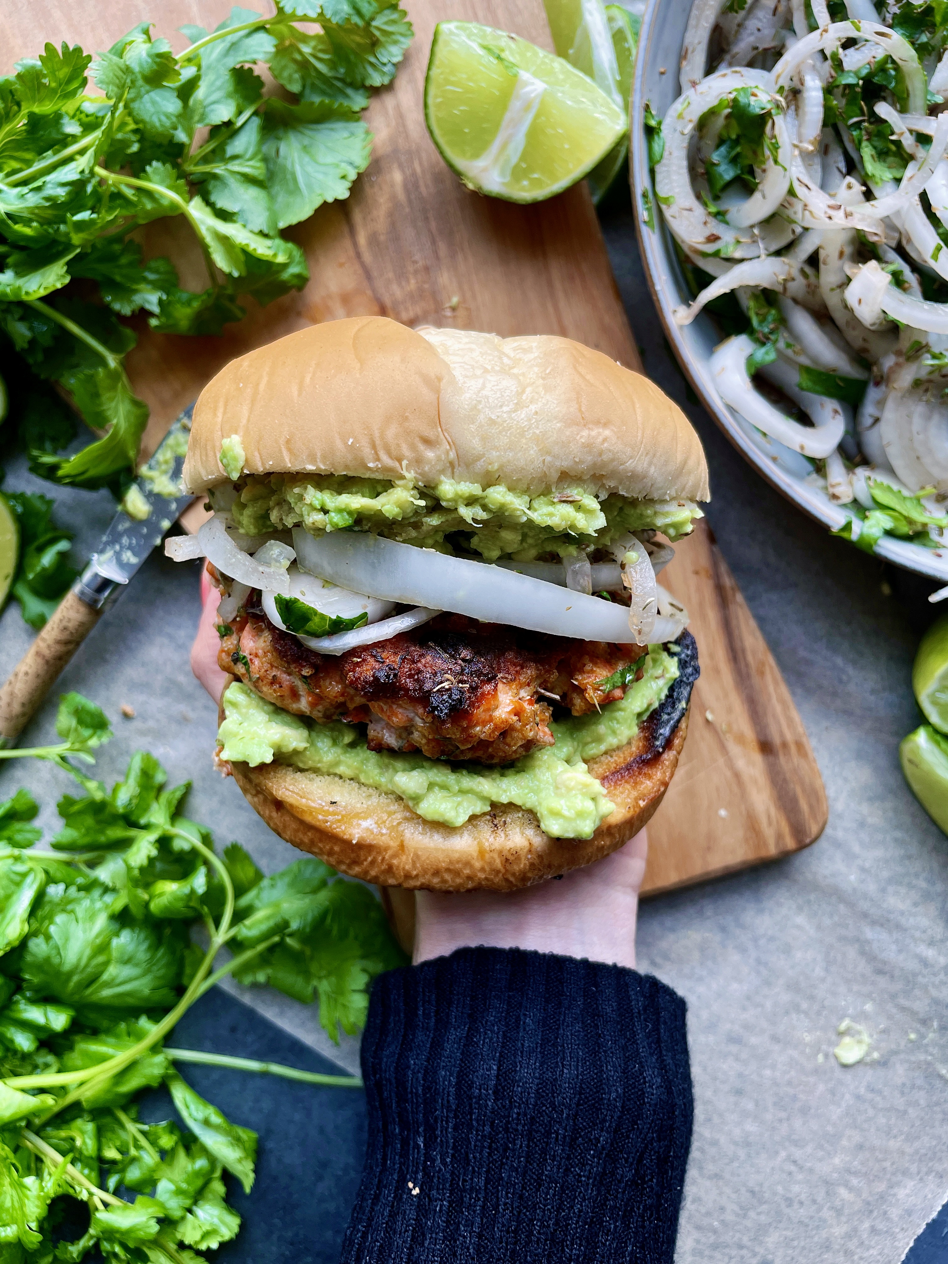 Crispy, juicy, and slightly tangy salmon patties layered over an easy avocado mash and cilantro marinated onions: these Zesty Avocado Cilantro Salmon Burgers are truly a game-changing dinner. 