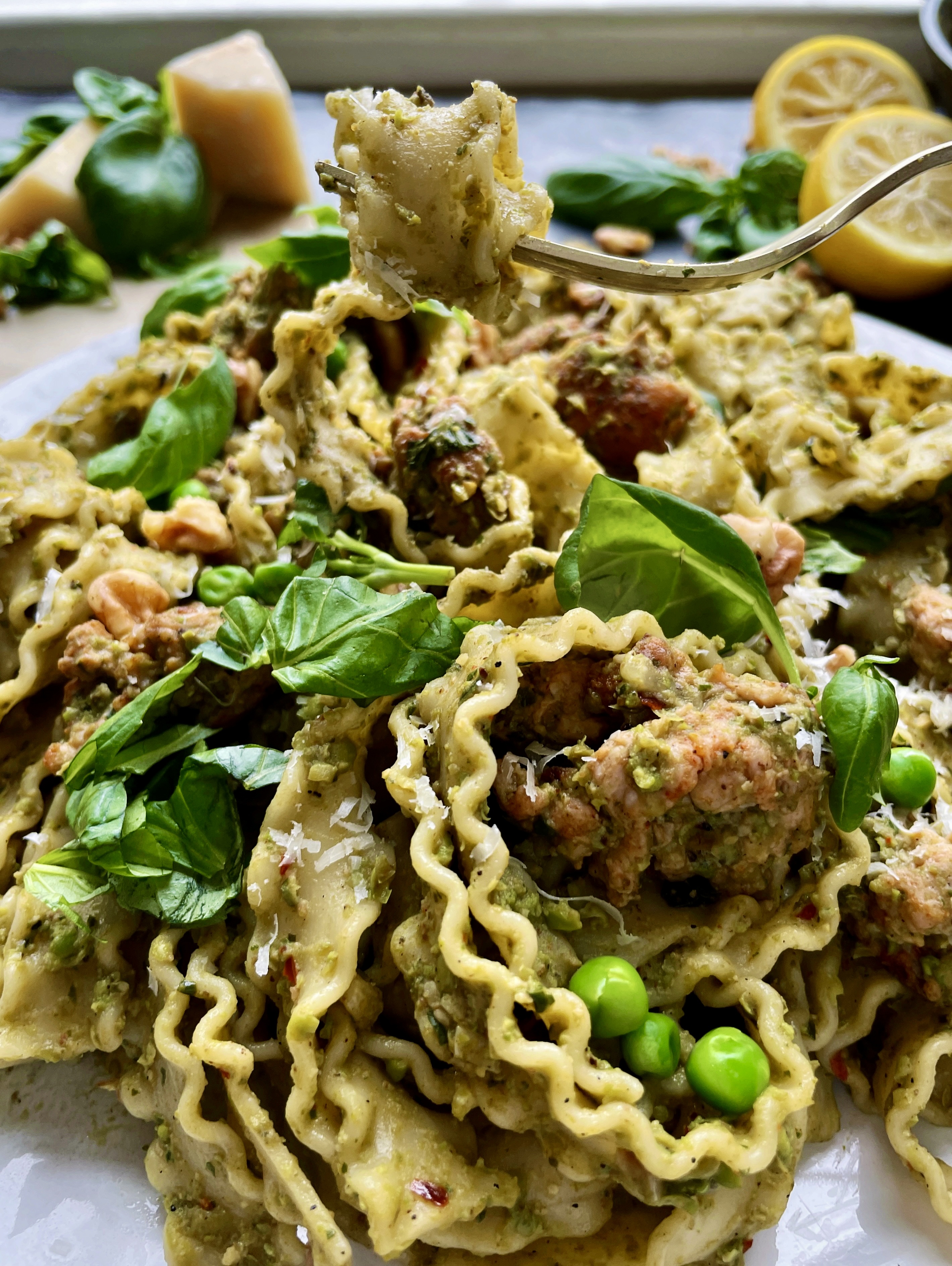 Charred, spicy, chicken sausage tossed up with a sharp parmesan, basil, and smashed pea pesto in your favorite pasta: this Spicy Chicken Sausage Pea Pesto Tagliatelle is my ultimate comfort food. 