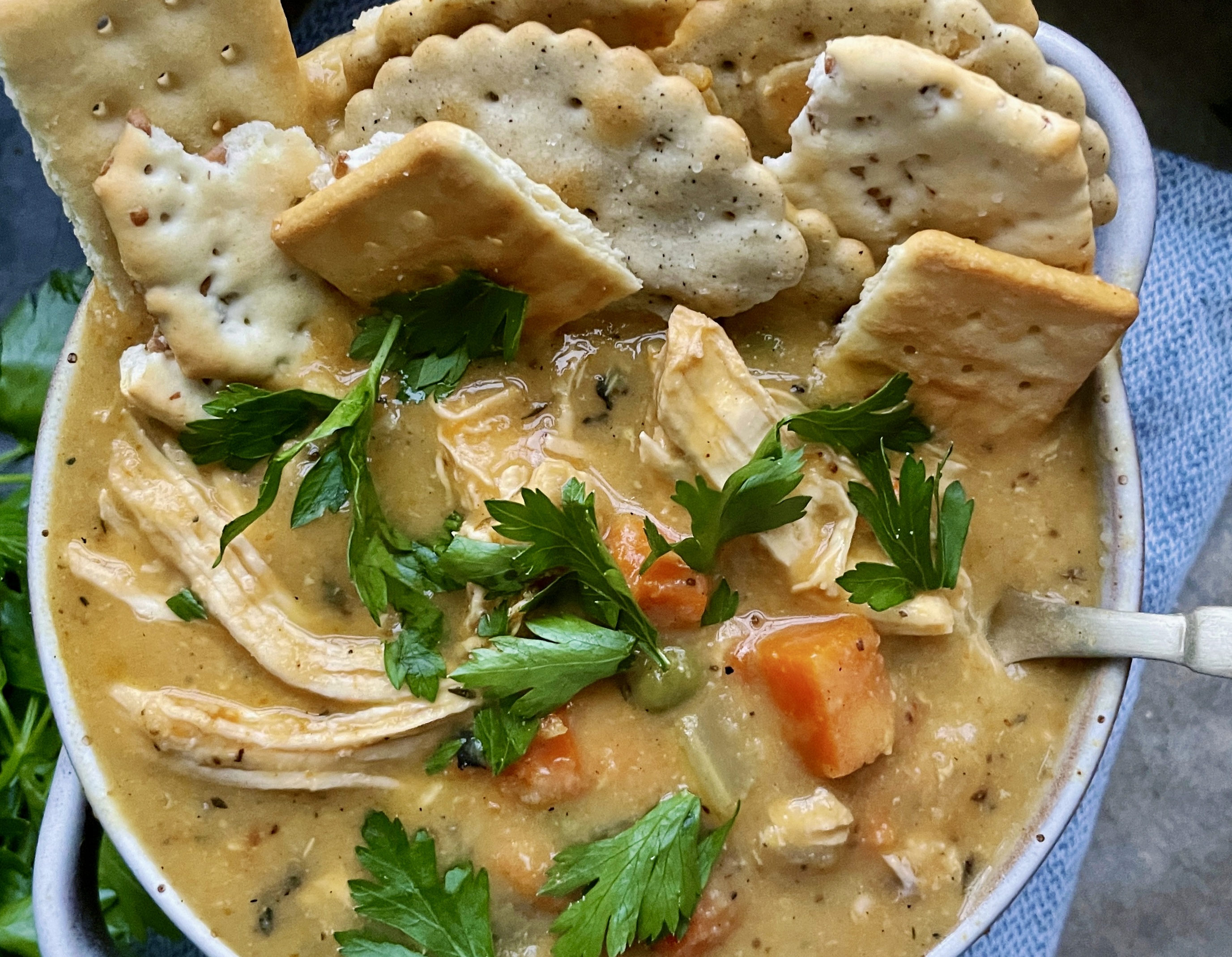 The creamy, nostalgic chicken and veggie pie lightened up in the most flavorful cozy soup of the season: I could eat this Healthier Chicken Pot Pie Soup every day this time of year!