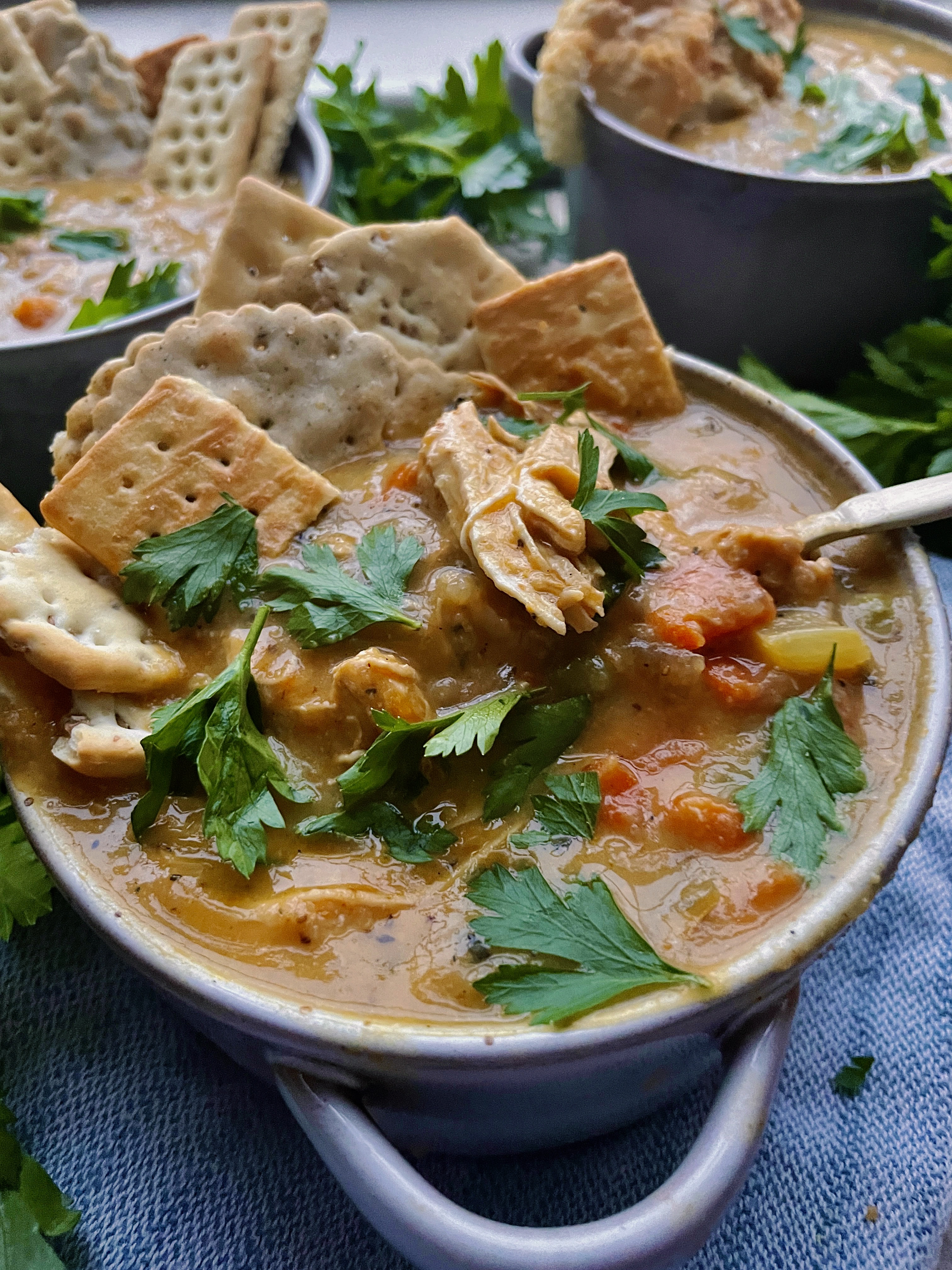 The creamy, nostalgic chicken and veggie pie lightened up in the most flavorful cozy soup of the season: I could eat this Healthier Chicken Pot Pie Soup every day this time of year!