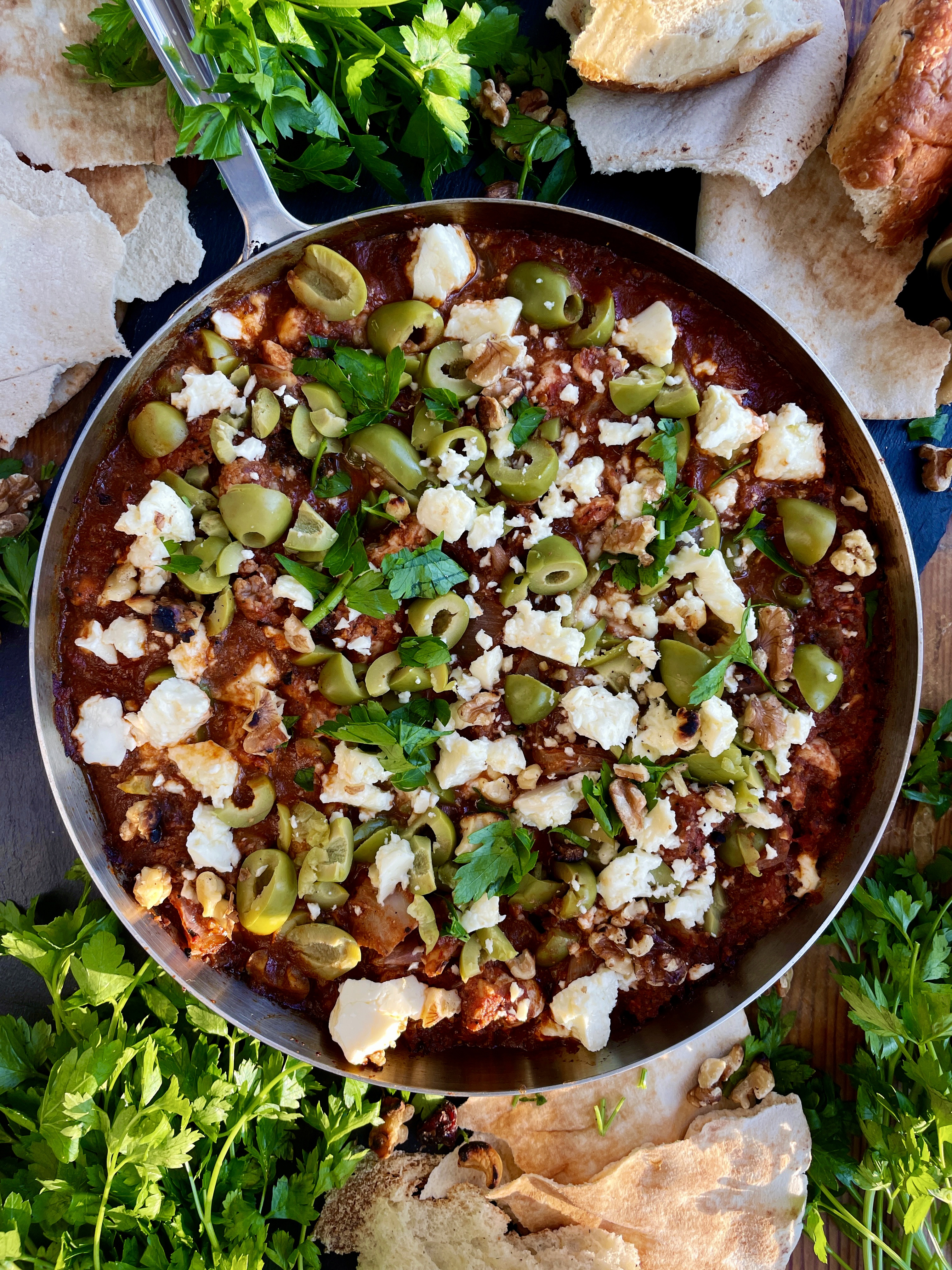 Crispy charred chicken and cauliflower sautéed up in a garlicky fire roasted tomato paste finished off with creamy feta cheese and castelvetrano olives: this Feta Olive and Walnut Chicken Skillet is a fav easy weeknight dinner!