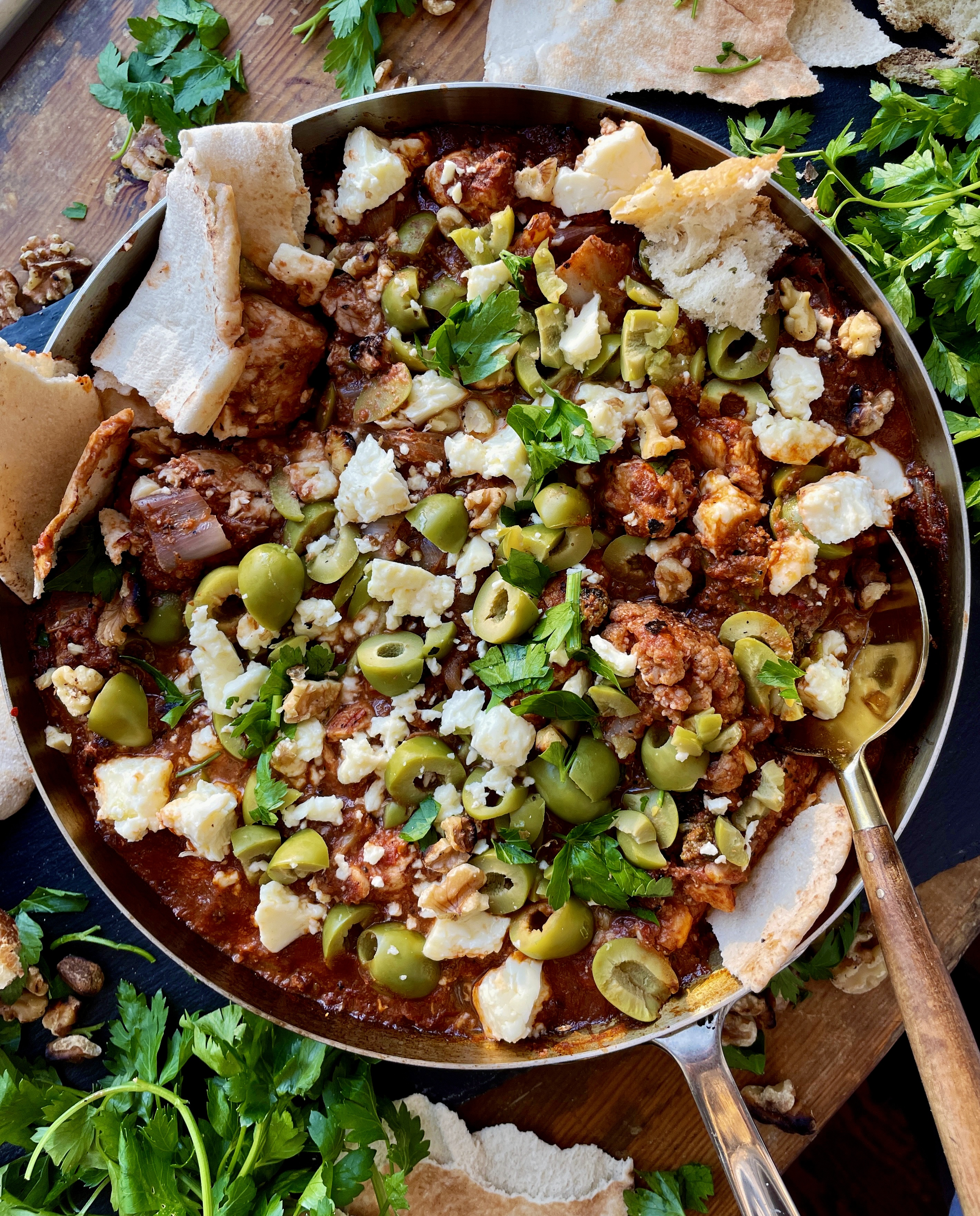 Crispy charred chicken and cauliflower sautéed up in a garlicky fire roasted tomato paste finished off with creamy feta cheese and castelvetrano olives: this Feta Olive and Walnut Chicken Skillet is a fav easy weeknight dinner!