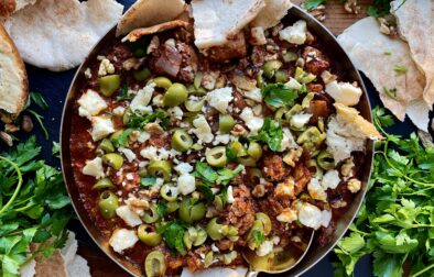 Crispy charred chicken and cauliflower sautéed up in a garlicky fire roasted tomato paste finished off with creamy feta cheese and castelvetrano olives: this Feta Olive and Walnut Chicken Skillet is a fav easy weeknight dinner!