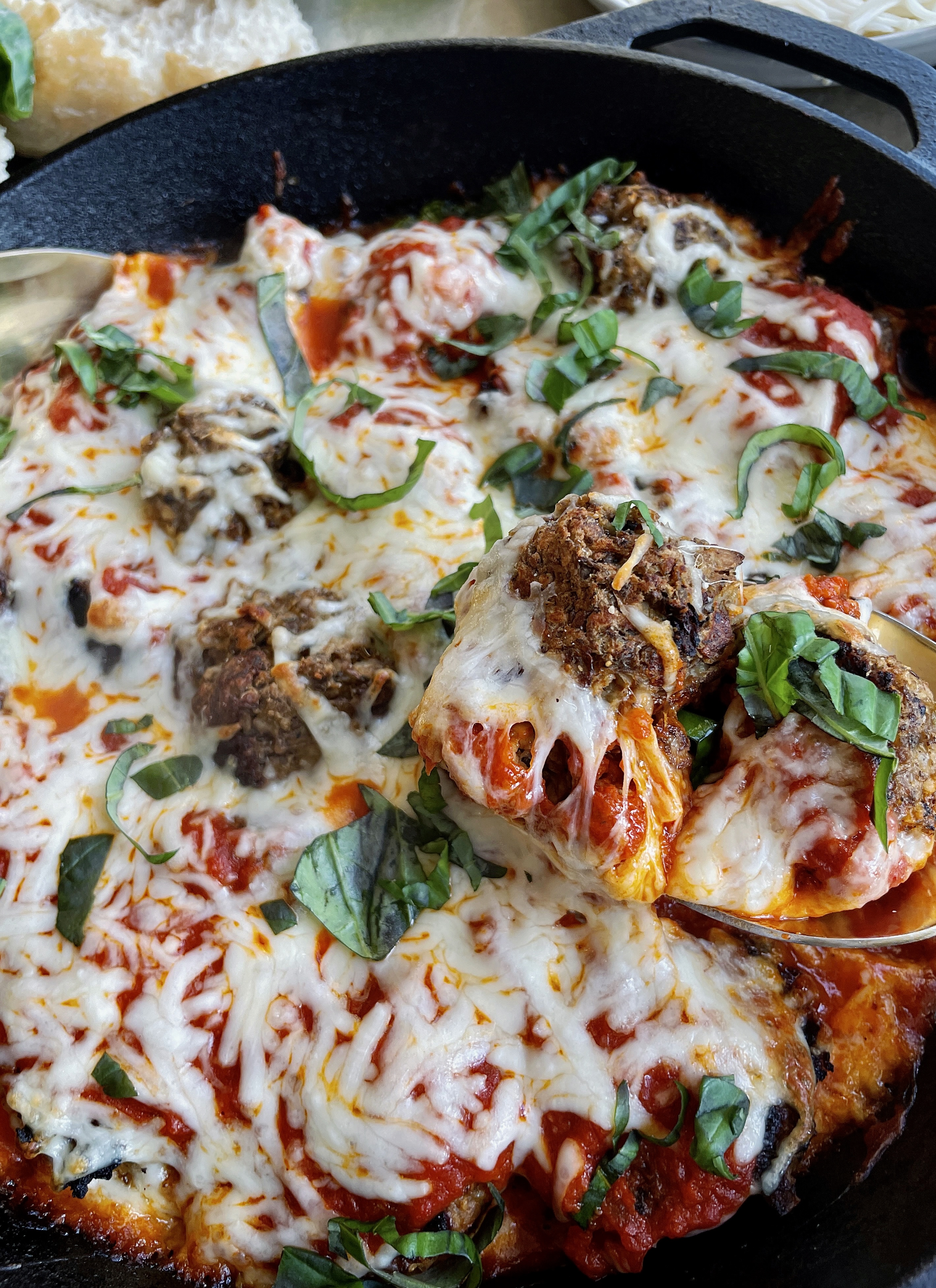 Lightly seared, veggie-filled, and protein-packed vegetarian meatballs baked off in marinara and all the cheese: this Cheesy Lentil Vegetarian "Meatball" Skillet is my favorite meatless weeknight dinner!