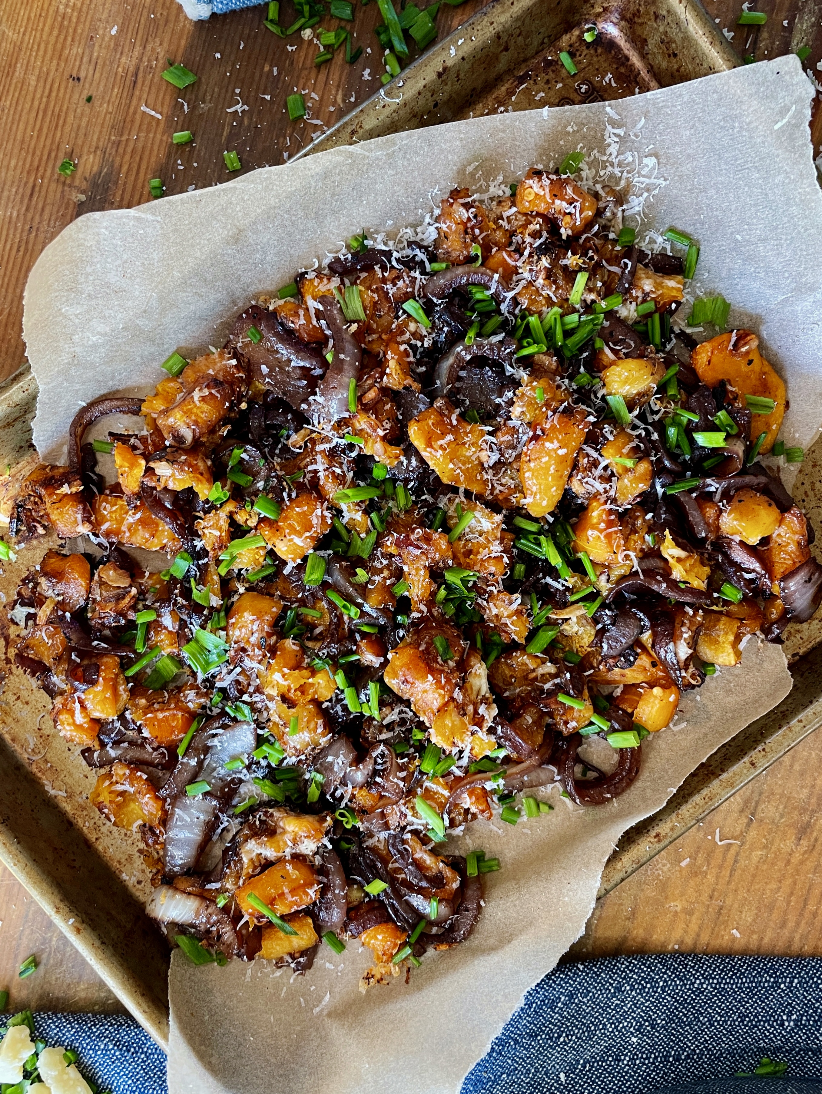 Golden, smashed, and perfectly glazed butternut squash cubes layered with red wine caramelized sweet onions and all the cheese: this French Onion Smashed Butternut Squash is the most perfect winter side. 