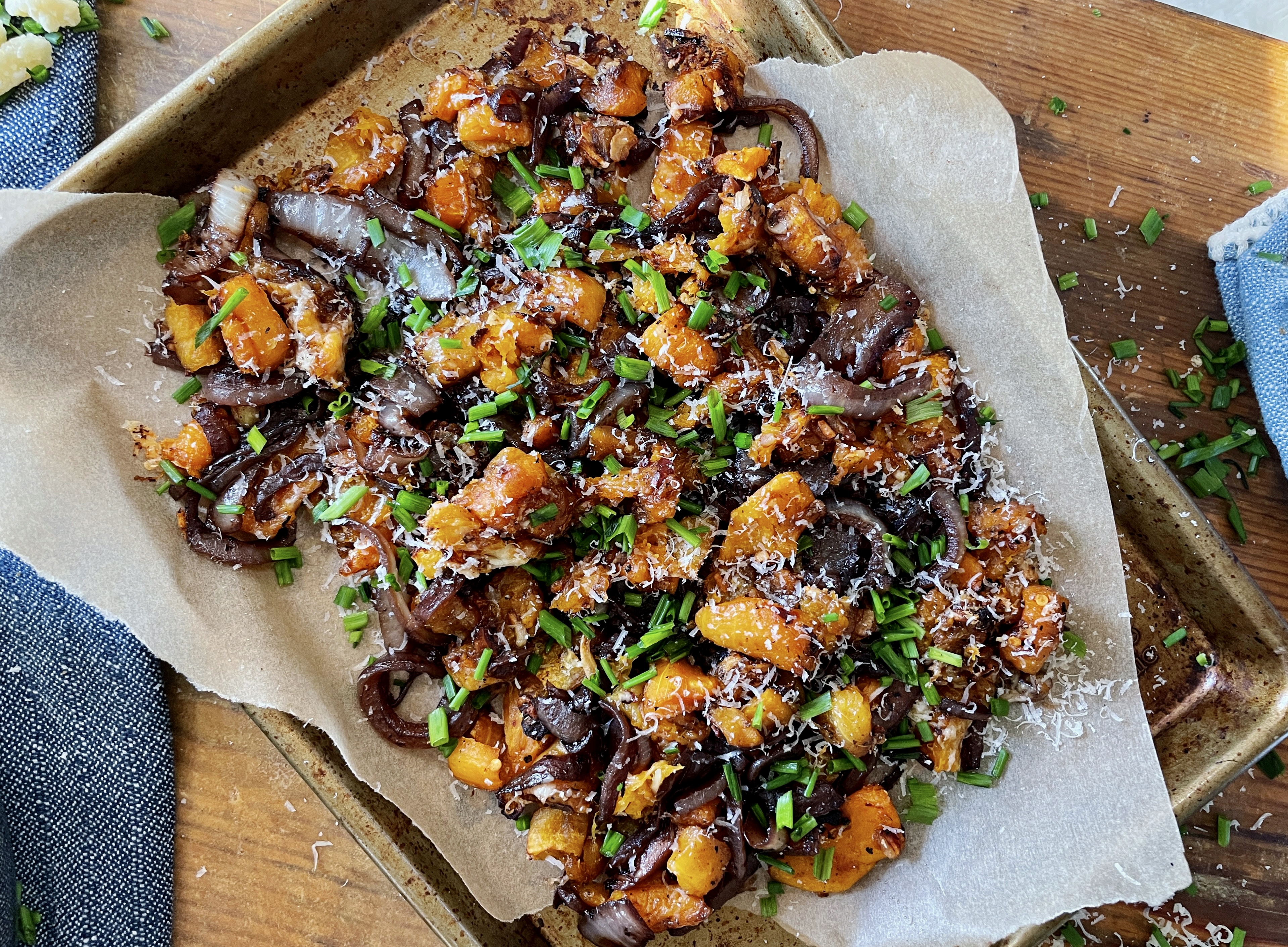 Golden, smashed, and perfectly glazed butternut squash cubes layered with red wine caramelized sweet onions and all the cheese: this French Onion Smashed Butternut Squash is the most perfect winter side.