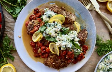 The easiest lemony sumac skillet chicken and tomatoes cooked down in garlicky white wine and finished with a cucumber mashed basil and mint feta: this Garlic Chicken with Roasted Tomatoes and Herbed Feta is truly my busy weeknight secret weapon.