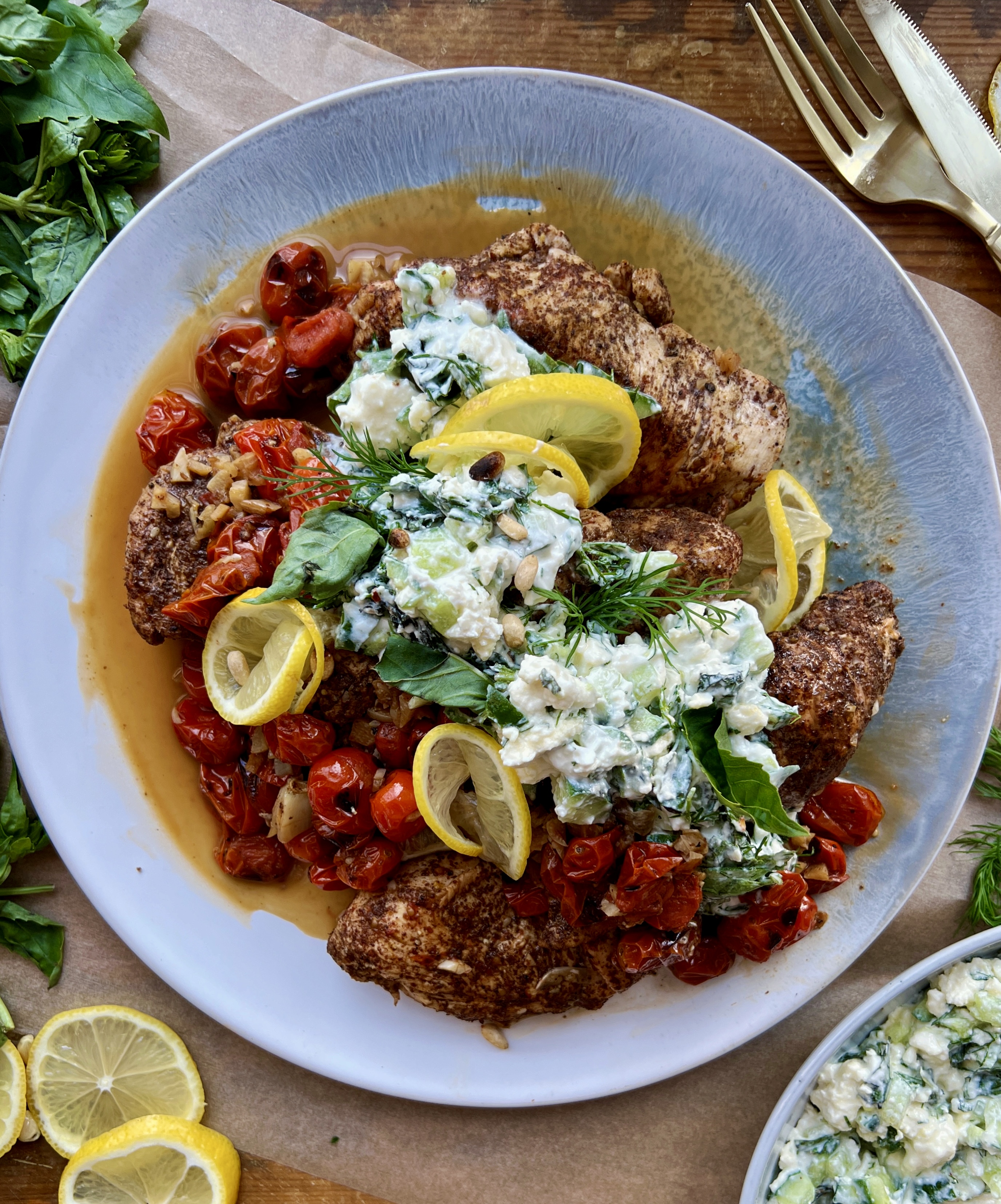  The easiest lemony sumac skillet chicken and tomatoes cooked down in garlicky white wine and finished with a cucumber mashed basil and mint feta: this Garlic Chicken with Roasted Tomatoes and Herbed Feta is truly my busy weeknight secret weapon. 