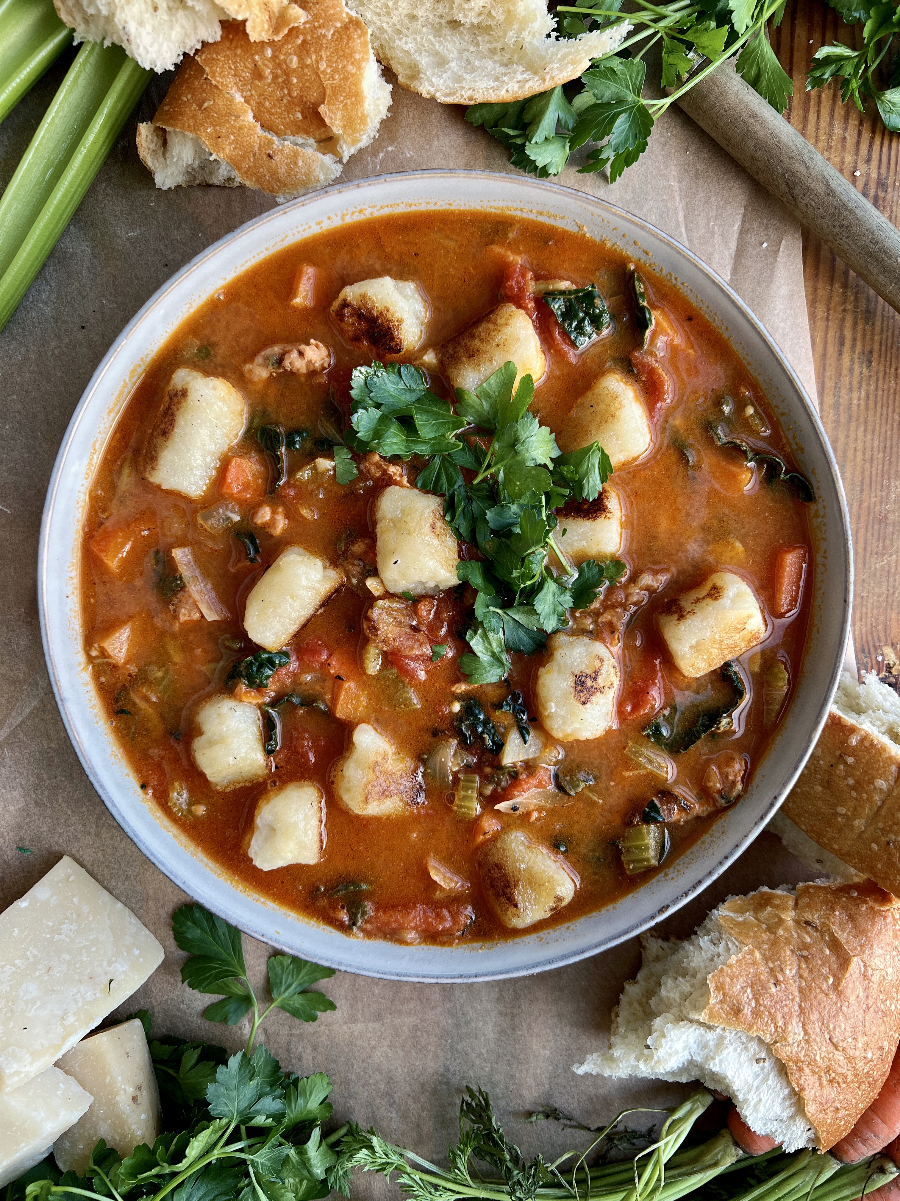 The warm and cozy yet hearty and healthy tomato based soup filled with veggies, white wine, and all the pillowy gnocchi: this Italian Sausage Tomato and Gnocchi Soup is truly getting me through this winter!