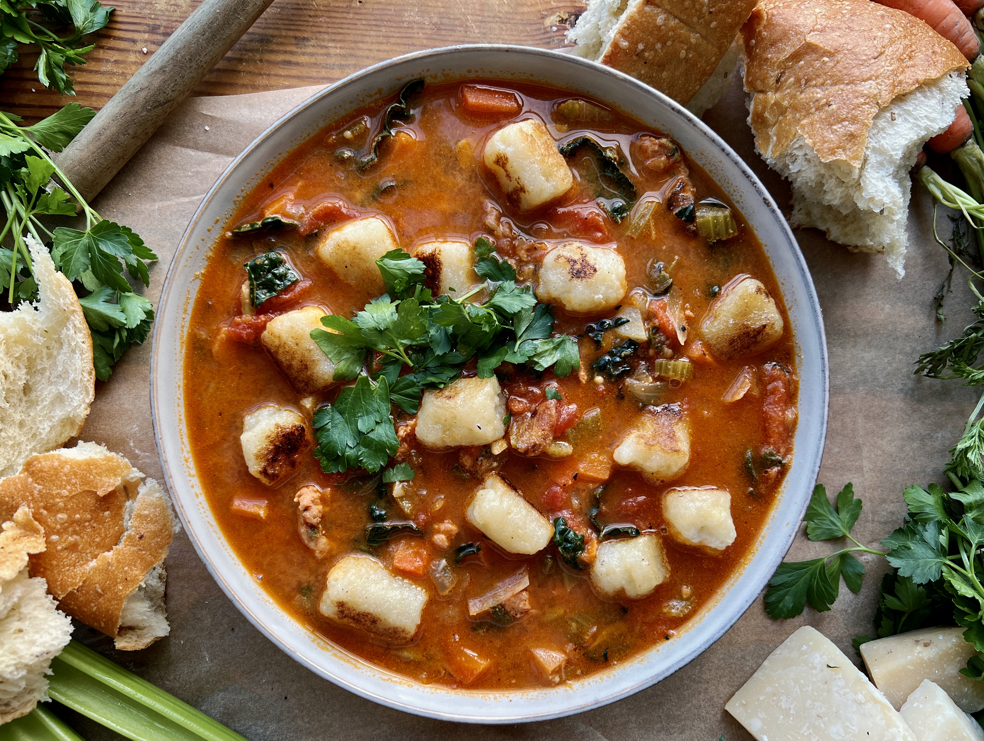 The warm and cozy yet hearty and healthy tomato based soup filled with veggies, white wine, and all the pillowy gnocchi: this Italian Sausage Tomato and Gnocchi Soup is truly getting me through this winter!