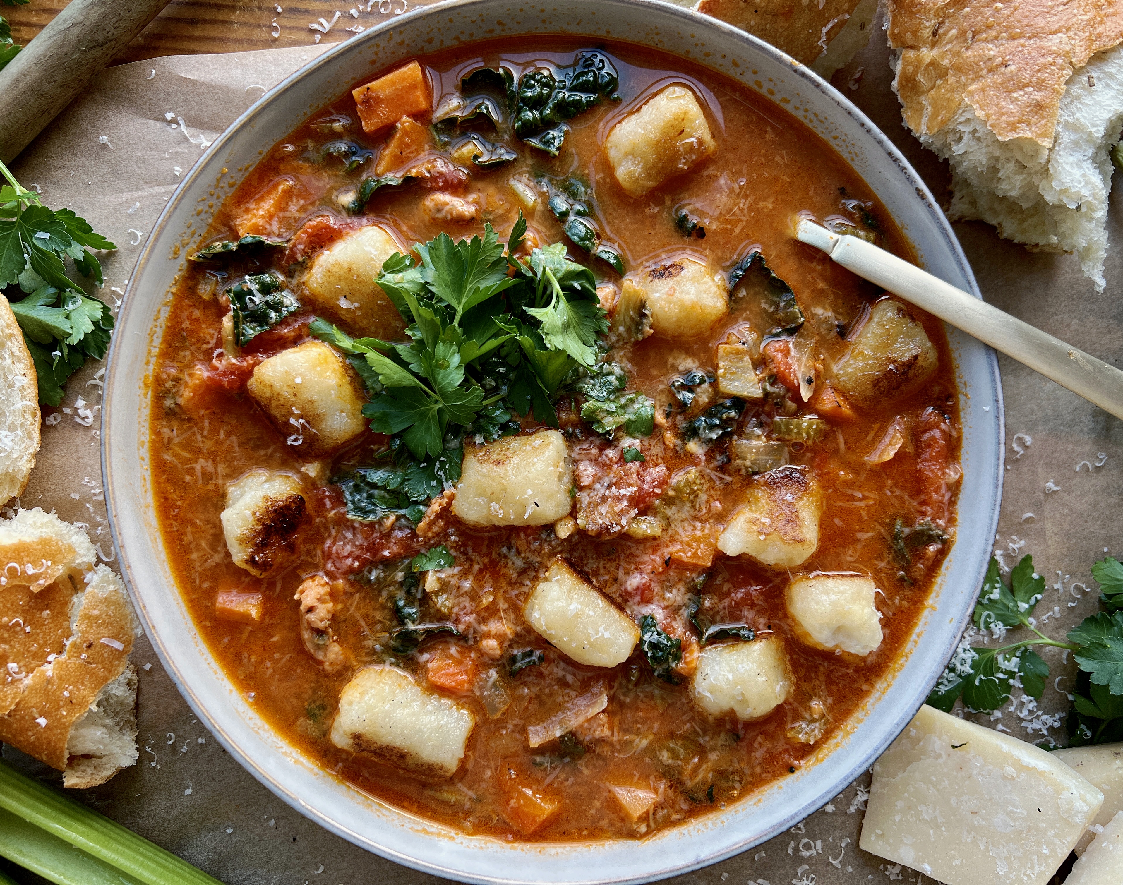 The warm and cozy yet hearty and healthy tomato based soup filled with veggies, white wine, and all the pillowy gnocchi: this Italian Sausage Tomato and Gnocchi Soup is truly getting me through this winter!