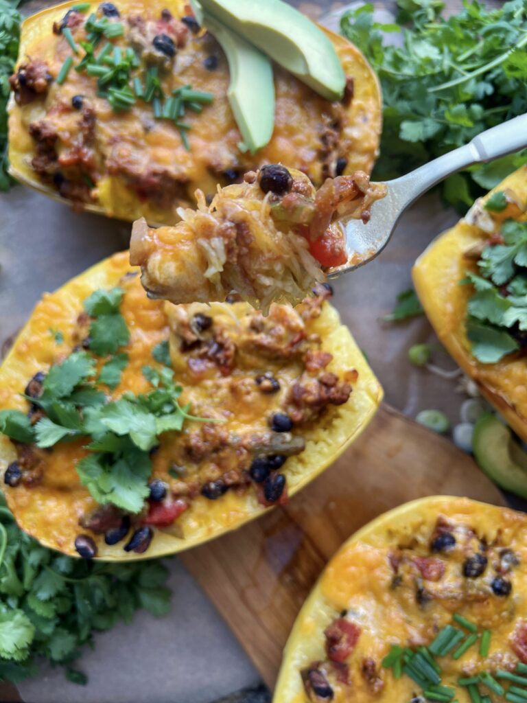  Warming spices mixed up in sautéed veggies, beans, tangy chiles, and all the cheese cooked down in a tomato sauce and tucked into roasted spaghetti squash boats: these Mexican Cheesy Bean and Turkey Spaghetti Squash Boats are everyone’s favorite dinner!