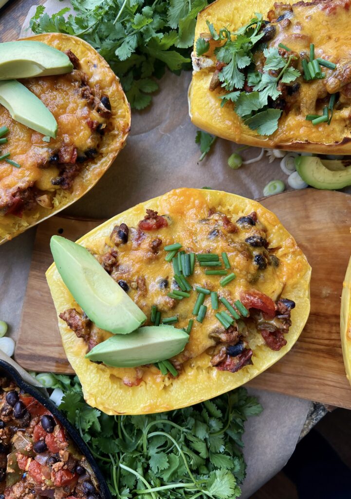  Warming spices mixed up in sautéed veggies, beans, tangy chiles, and all the cheese cooked down in a tomato sauce and tucked into roasted spaghetti squash boats: these Mexican Cheesy Bean and Turkey Spaghetti Squash Boats are everyone’s favorite dinner!