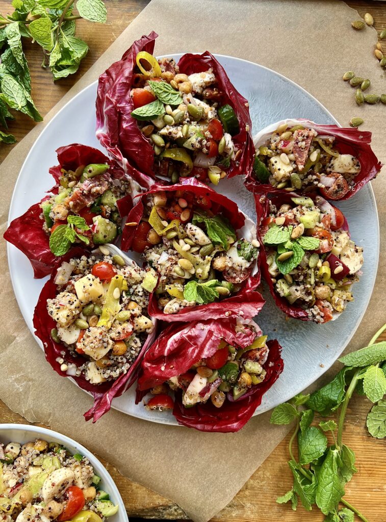 All the best fresh, Italian ingredients stuffed into some bitter, bright purple radicchio with quinoa, double the cheese, and so much flavor: these LA Chop Quinoa Radicchio Wraps are the perfect healthy lunch or dinner!