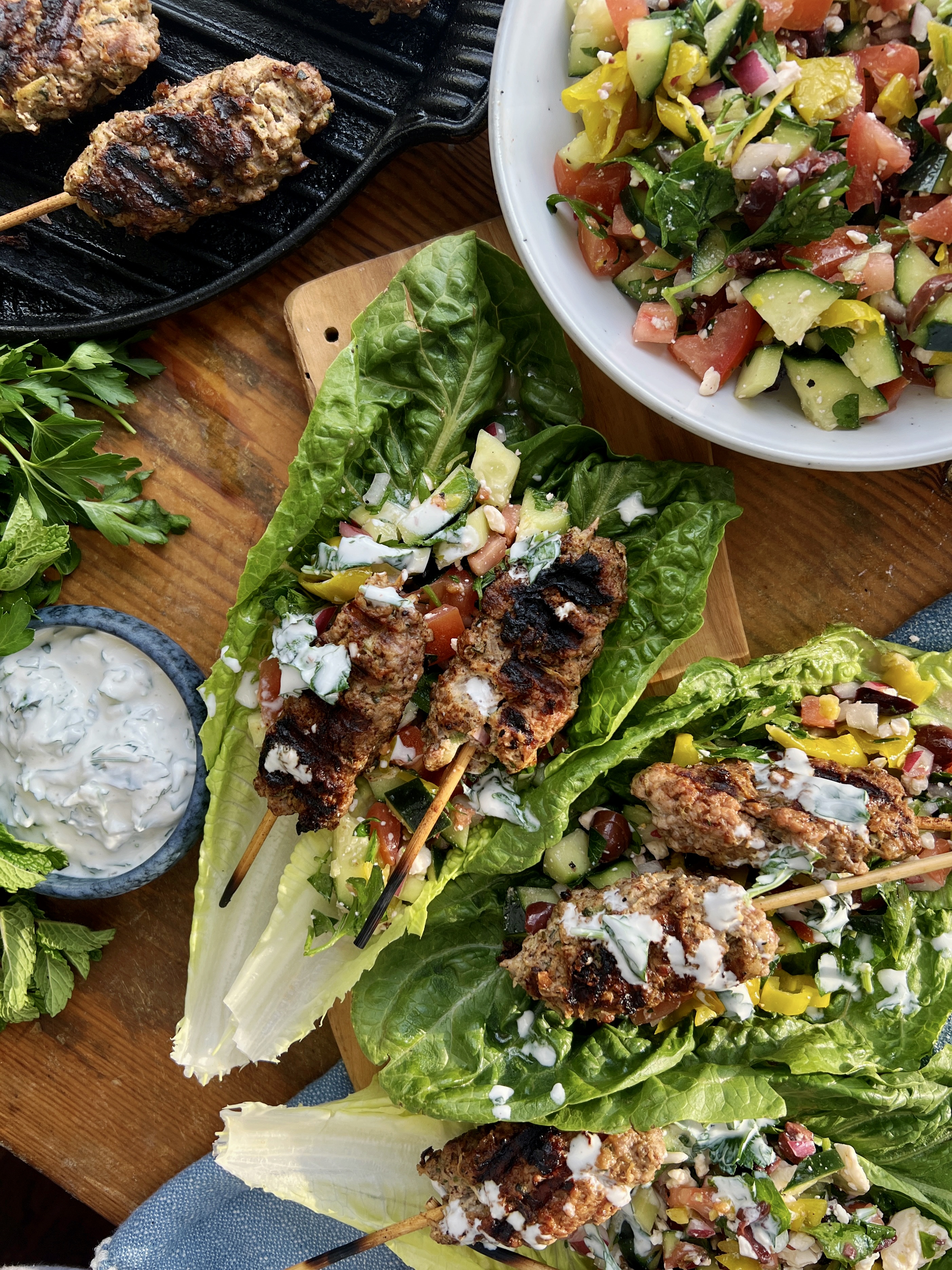 The juiciest Middle Eastern tahini and sumac packed skewers tucked into a lettuce wrap with a quick chopped topping and the most refreshing dressing: these Romaine Kofta Wraps with Mint Yogurt Drizzle are my go-to healthy dinner!