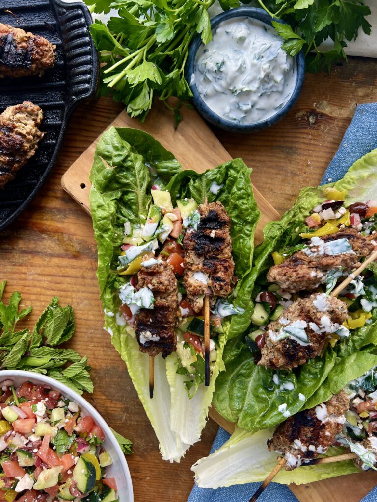 The juiciest Middle Eastern tahini and sumac packed skewers tucked into a lettuce wrap with a quick chopped topping and the most refreshing dressing: these Romaine Kofta Wraps with Mint Yogurt Drizzle are my go-to healthy dinner!