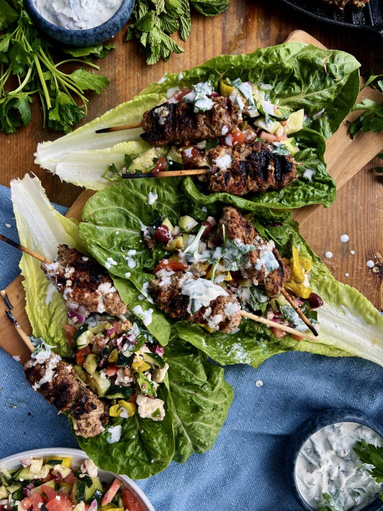 The juiciest Middle Eastern tahini and sumac packed skewers tucked into a lettuce wrap with a quick chopped topping and the most refreshing dressing: these Romaine Kofta Wraps with Mint Yogurt Drizzle are my go-to healthy dinner!