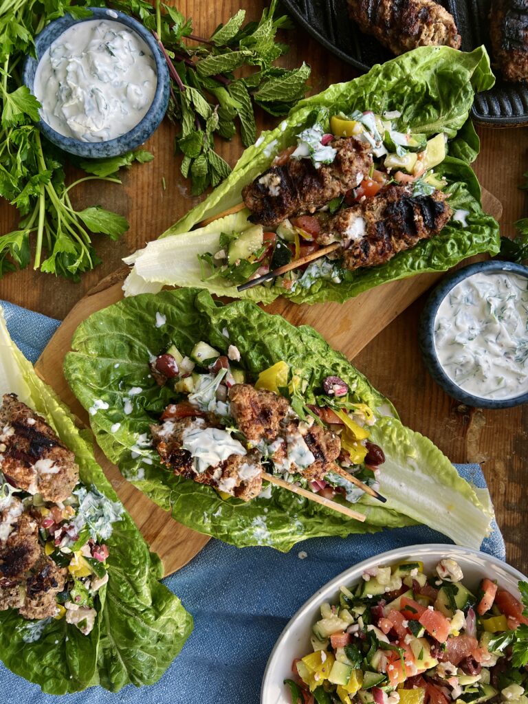 The juiciest Middle Eastern tahini and sumac packed skewers tucked into a lettuce wrap with a quick chopped topping and the most refreshing dressing: these Romaine Kofta Wraps with Mint Yogurt Drizzle are my go-to healthy dinner!