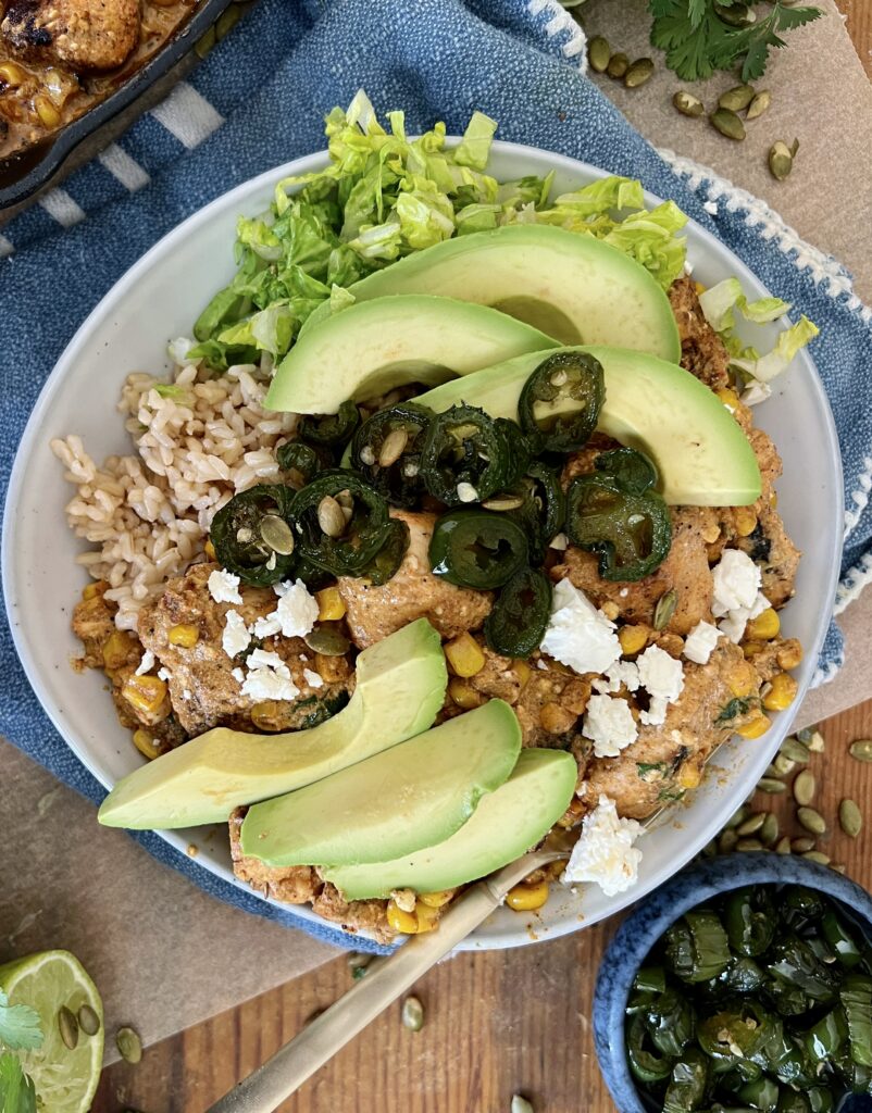 Honey-glazed jalapeños, the creamiest salty and sweet Mexican corn dip, and crispy spiced chicken all thrown together over your fav grain: these Mexican Street Corn Chicken and Jalapeño Bowls are a game-changing dinner.