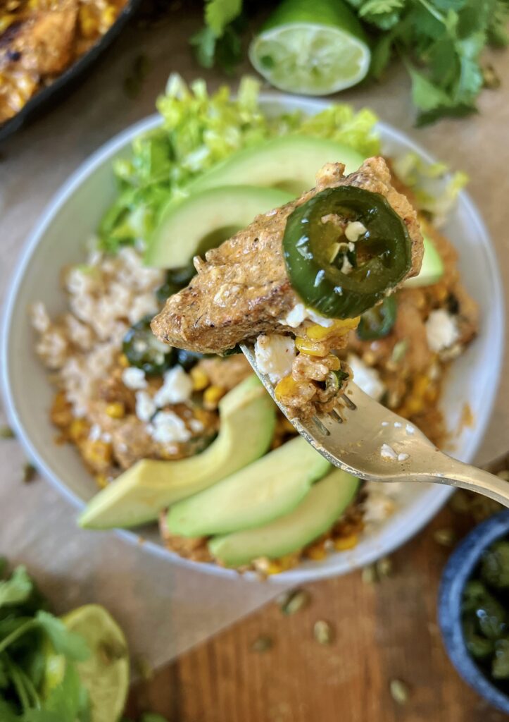 Honey-glazed jalapeños, the creamiest salty and sweet Mexican corn dip, and crispy spiced chicken all thrown together over your fav grain: these Mexican Street Corn Chicken and Jalapeño Bowls are a game-changing dinner.